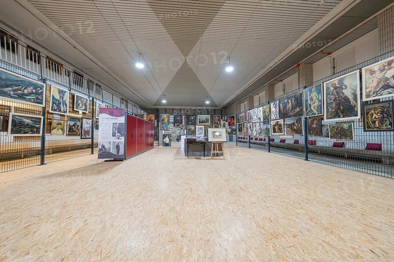 Large exhibition area in an art gallery with paintings on the walls, historical art exhibition in the old swimming pool, show depot, Calw, Black Forest, Germany