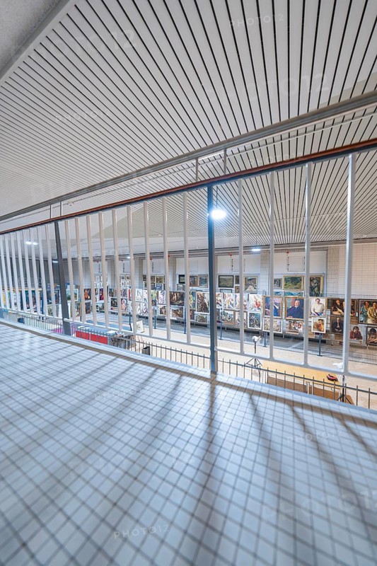View over a grille into a modern exhibition room with works of art, historical art exhibition in the old swimming pool, Schaudepot, Calw, Black Forest, Germany