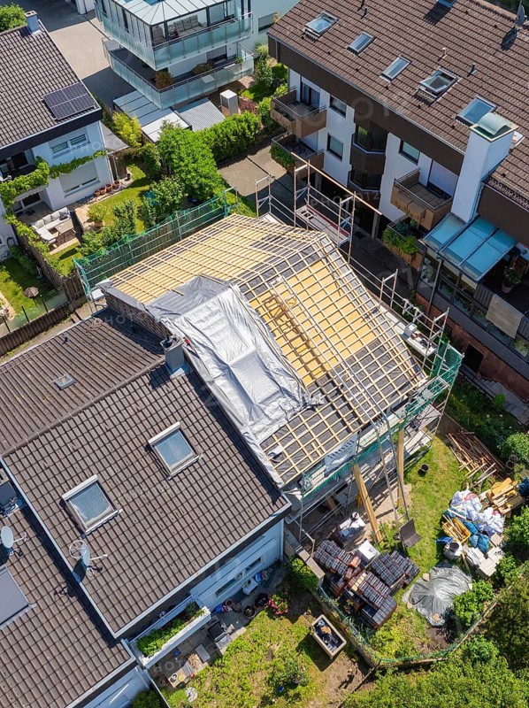 Aerial view of a house with roof under construction in suburban location, roof renovation, house construction, Pforzheim, Germany