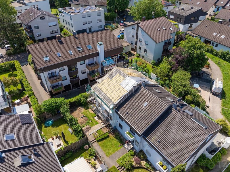 Aerial view of a residential area with a house showing roof work in the middle of green areas, roof renovation, house construction, Pforzheim, Germany