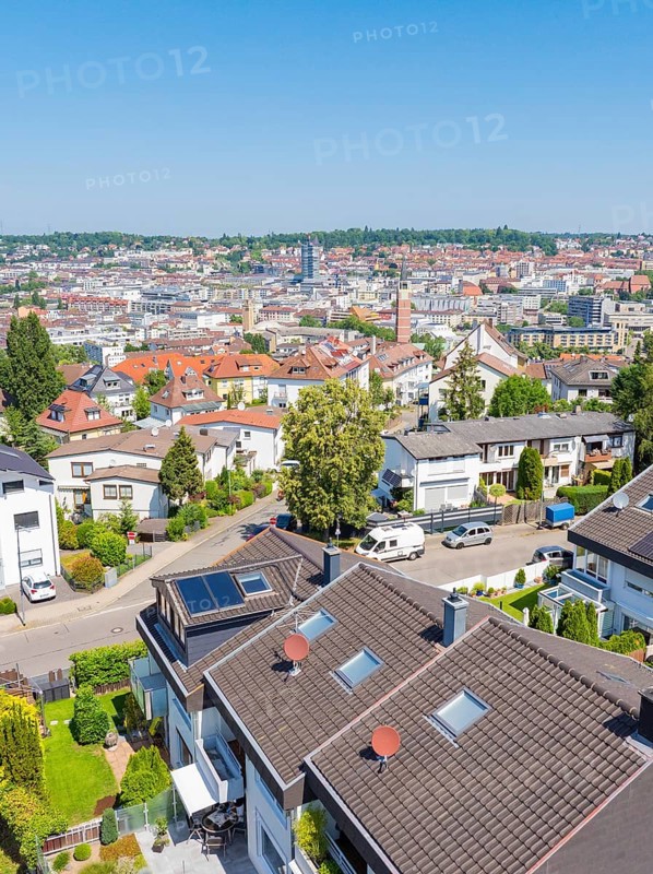 View of a residential area with tiled roofs and neighbouring urban skyline, roof renovation, house construction, Pforzheim, Germany
