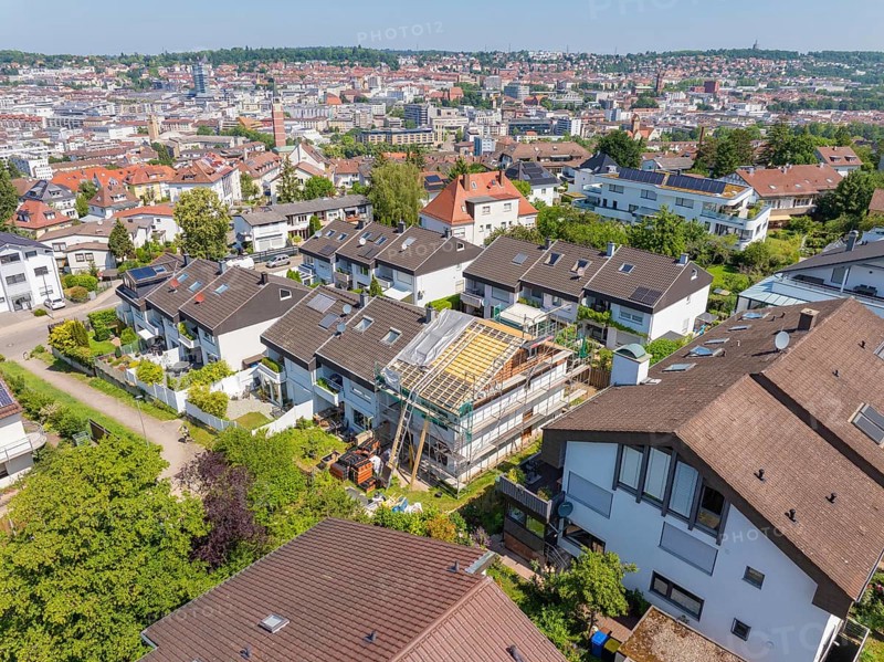 City view with focus on a renovated house roof in a residential area, roof renovation, house construction, Pforzheim, Germany