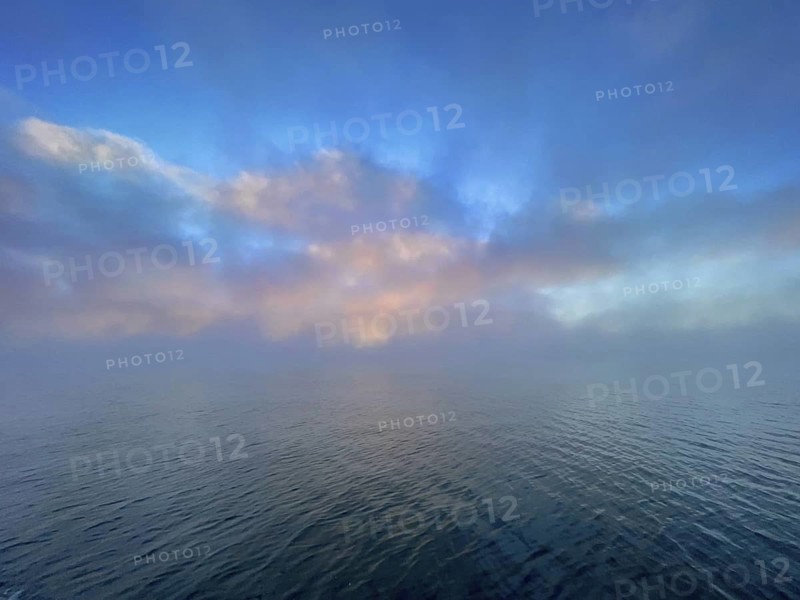Fog and clouds over Lake Starnberg, Bavaria, Germany