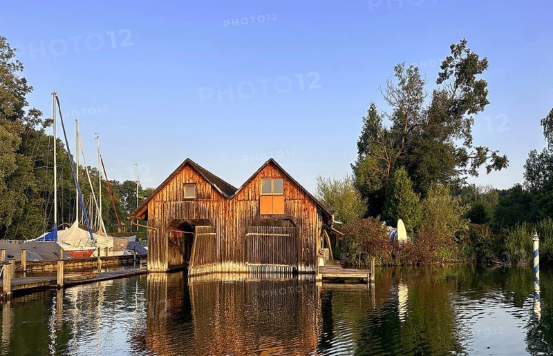 Boathouses on Lake Starnberg in the evening, Bavaria, Germany