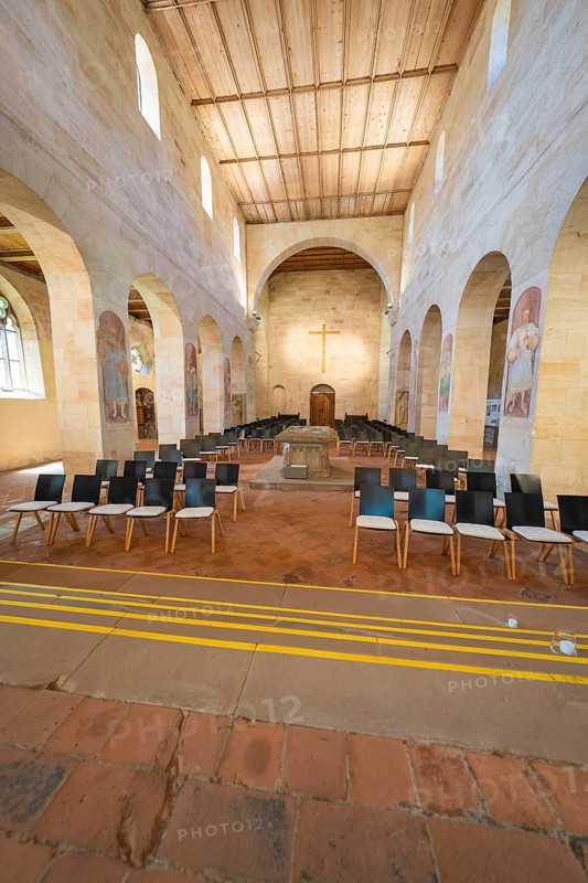 Church interior with organised pews and a central cross, event and wedding location Lorch Monastery, Lorch, Germany
