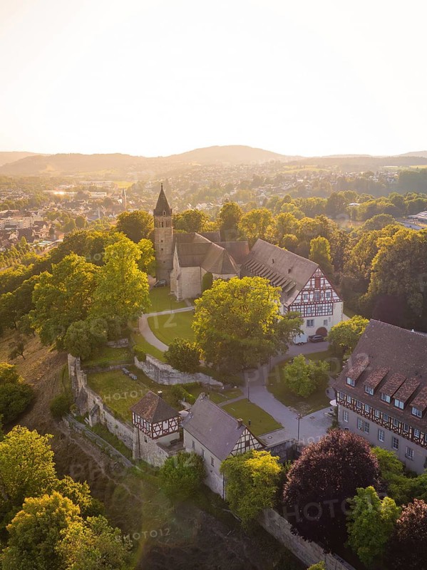 Old church and building on a hill surrounded by trees, event and wedding location Lorch Monastery, Lorch, Germany