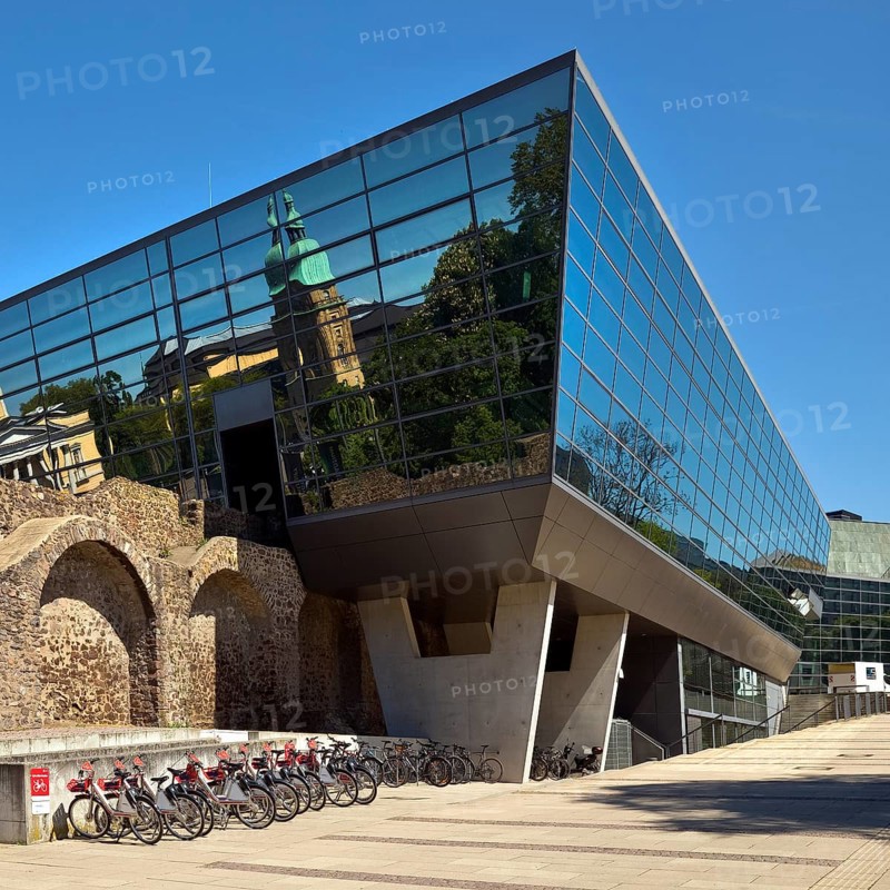 West side of the Darmstadtium congress centre with historic city wall in the centre of Darmstadt, Hesse, Germany