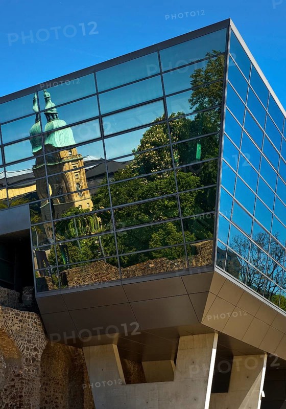 West side of the Congress Centre Darmstadtium with reflection of the Hessian State Museum in the centre of Darmstadt, Hesse, Germany