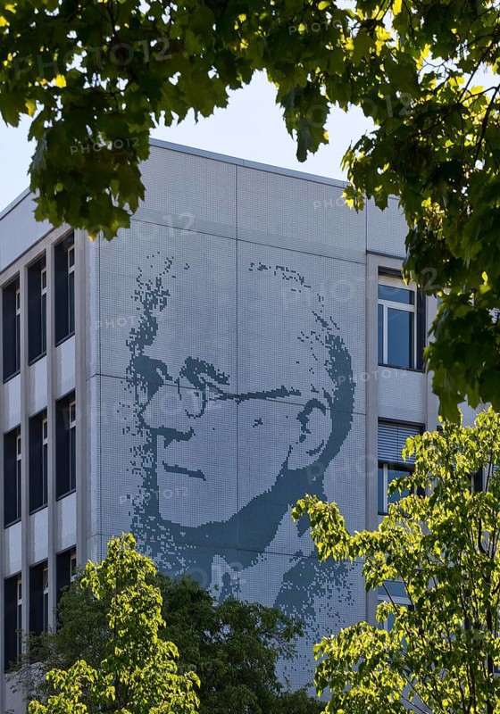 Vocational school centre Mitte Peter-Behrens-Schule with the portrait of Peter Behrens on the exterior facade, Darmstadt, Hesse, Germany