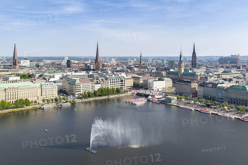 Aerial view of the Inner Alster with Jungfernstieg and Alster fountain against a blue sky, Hamburg, Germany
