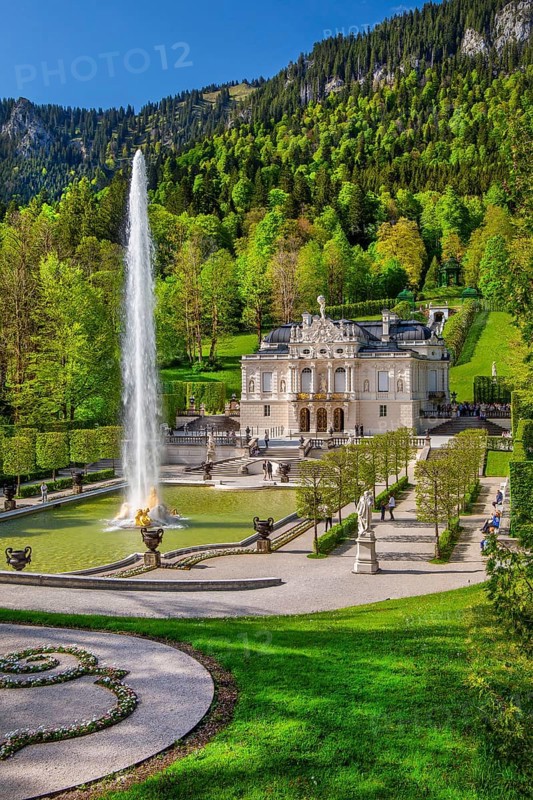 Water parterre with large fountain and portal of Linderhof Castle in spring, municipality of Ettal, Ammergau Alps, Ammertal, Upper Bavaria, Bavaria, Germany