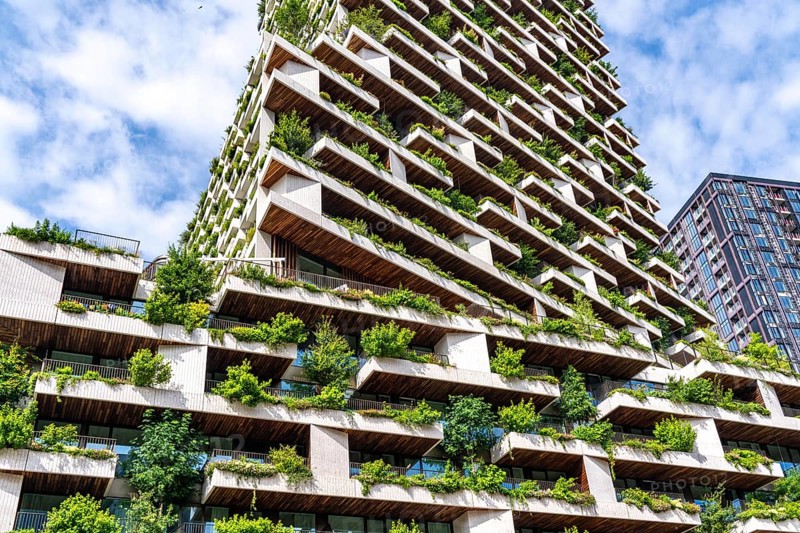 Wonderwoods residential tower, one of 2 green buildings, in Utrecht in the new Healthy Urban Quarter, at the central station, 105 metres high with 30 floors, Tower II, over 360 trees and over 9600 shrubs and flowering plants native to the region, all irrigated with collected rainwater, sponge city principle and monitored with sensors, Utrecht, Netherlands