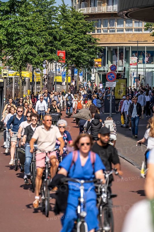 Central cycle path along the Vredenburg, in the city centre of Utrecht, lanes for pedestrians, cyclists and local traffic are separated, dense traffic, no car/truck traffic, Utrecht, Netherlands