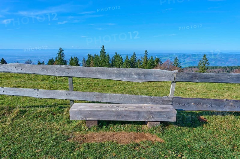 Wooden bench, on the Kandel Höhenweg, with a wide view over wooded landscape, Kandel, Waldkirch, Black Forest, Baden-Württemberg, Germany