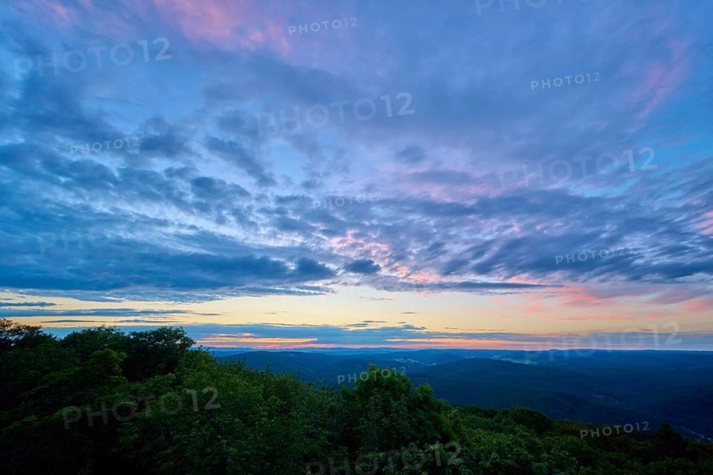 Twilight sky with purple and blue clouds over the landscape, Katzenbuckel, Waldbrunn, Neckar-Odenwald-Kreis, Odenwald, Baden-Württemberg, Germany