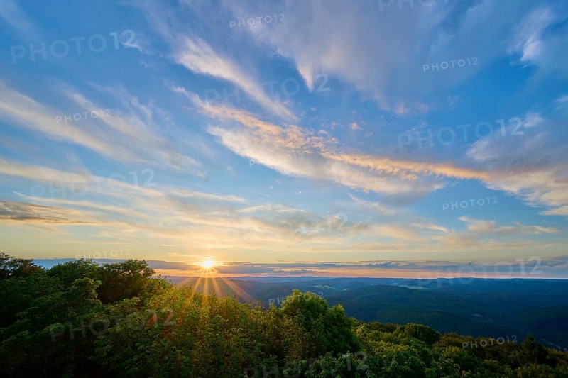 Sunset over mountains with dramatic clouds and lush greenery in the foreground, Katzenbuckel, Waldbrunn, Neckar-Odenwald-Kreis, Odenwald, Baden-Württemberg, Germany