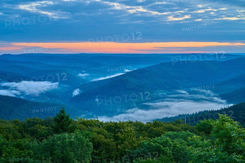 Mountain landscape with fog in the valleys at sunrise, blue sky, Katzenbuckel, Waldbrunn, Neckar-Odenwald-Kreis, Odenwald, Baden-Württemberg, Germany