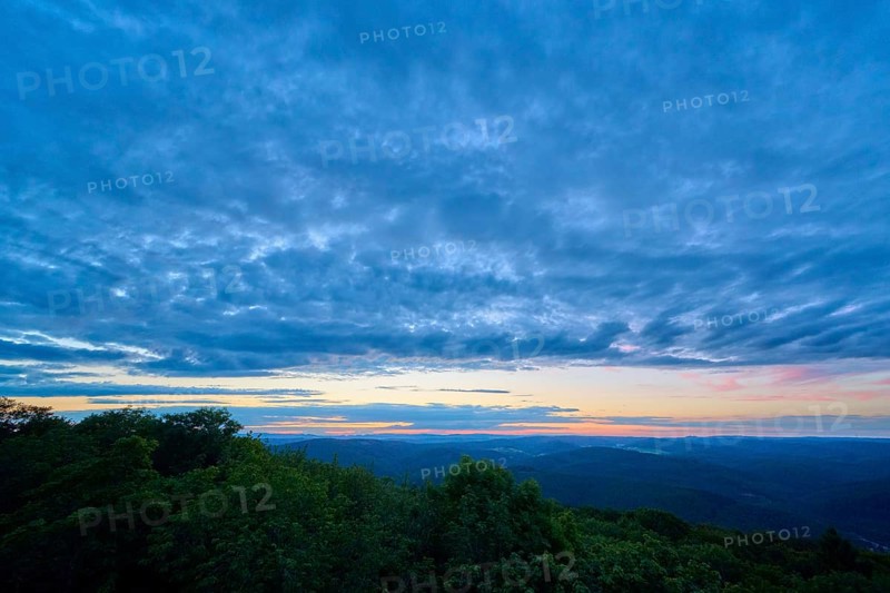 Dark blue sky towards the end of the sunset over a wooded region, Katzenbuckel, Waldbrunn, Neckar-Odenwald-Kreis, Odenwald, Baden-Württemberg, Germany