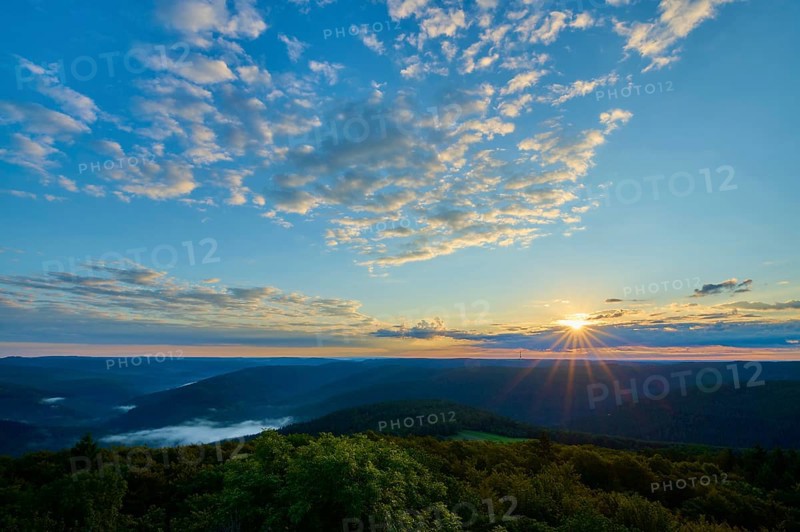 Sunrise over wooded hills, sky with light clouds and warm morning light, Katzenbuckel, Waldbrunn, Neckar-Odenwald-Kreis, Odenwald, Baden-Württemberg, Germany