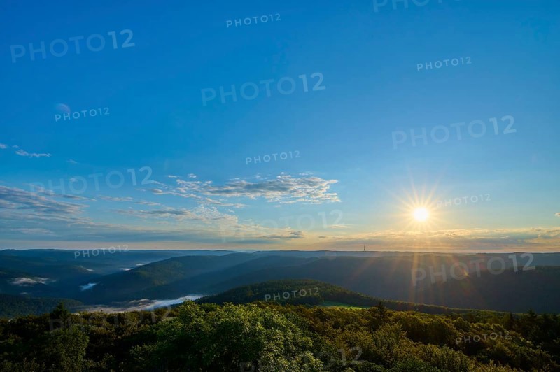 Sunrise with clear sky and wide view over wooded hills, Katzenbuckel, Waldbrunn, Neckar-Odenwald-Kreis, Odenwald, Baden-Württemberg, Germany