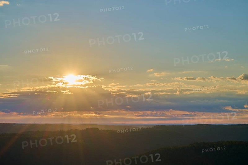 Sunrise over a calm landscape with clouds and rays of light, Katzenbuckel, Waldbrunn, Neckar-Odenwald-Kreis, Odenwald, Baden-Württemberg, Germany