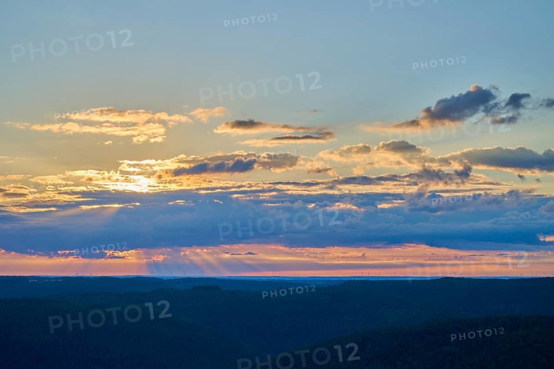 Morning sky with coloured clouds and rays of light over the landscape, Katzenbuckel, Waldbrunn, Neckar-Odenwald-Kreis, Odenwald, Baden-Württemberg, Germany