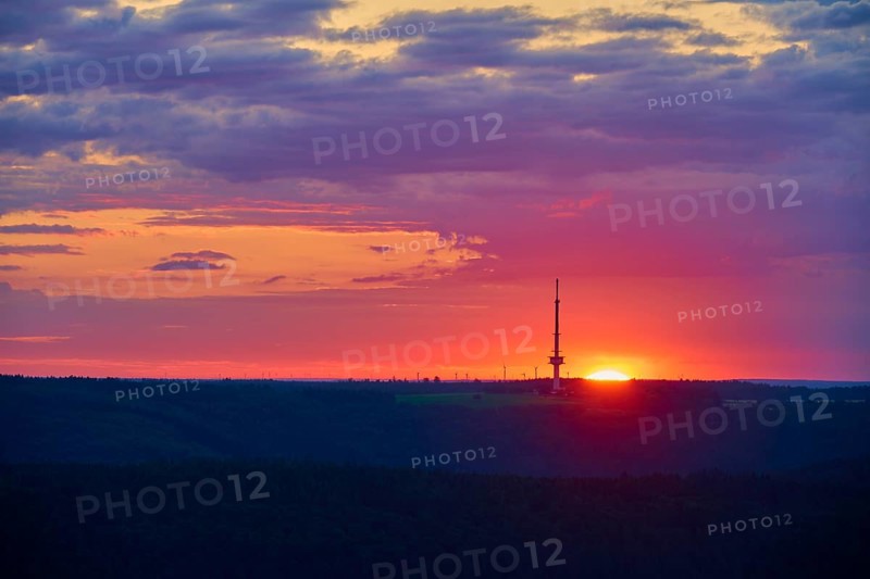 A bright sunrise with a prominent transmitter mast, Reisenbach transmitter, seen from the Katzenbuckel, Reisenbach, Mudau, Neckar-Odenwald-Kreis, Odenwald, Baden-Württemberg, Germany