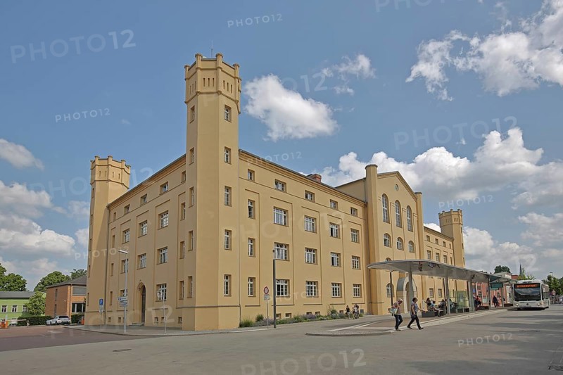 Karlskaserne barracks with corner towers and battlements built in 1919 and today's city administration, Kreishaus I., bus stop, Bernburg, Saxony-Anhalt, Germany