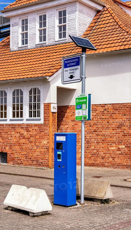 Blue parking ticket machine in the town harbour of Sassnitz, Rügen, Mecklenburg-Vorpommern, Germany