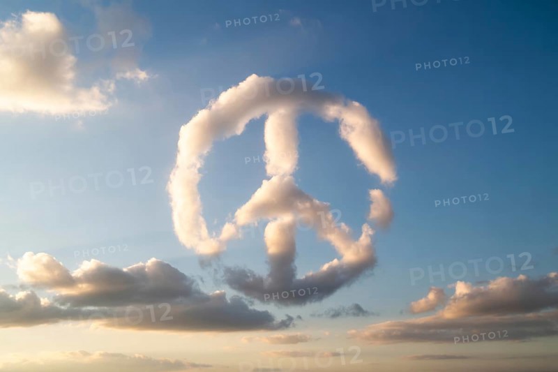 A naturally formed peace sign made of white clouds floats in a clear blue sky, symbolizing harmony and hope. Generative ai, AI generated