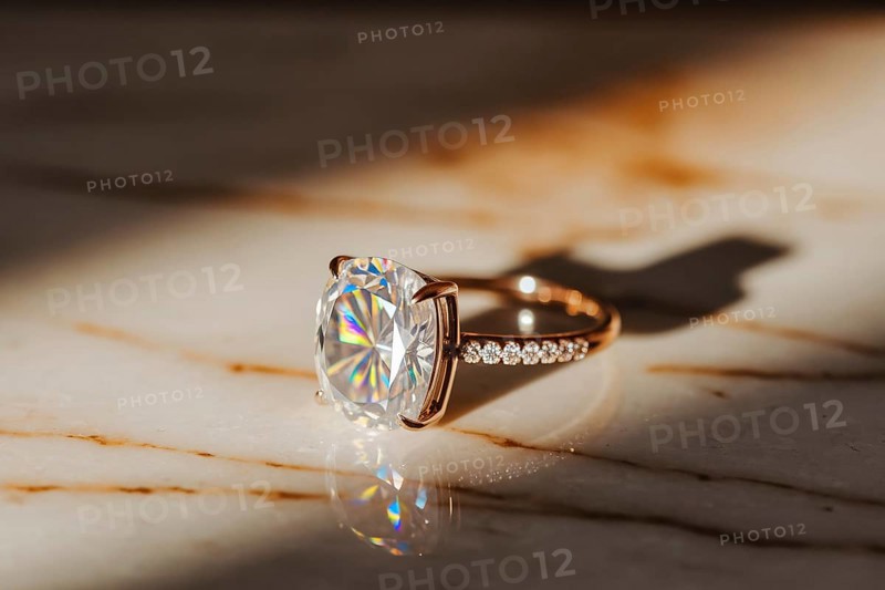 Close-up of diamond ring on polished marble surface with warm light and shimmering brilliance. Generative ai, AI generated