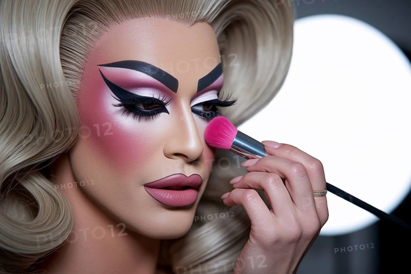 A drag queen applying vibrant pink blush in warm studio light, highlighting flawless skin and makeup artistry. Generative AI, AI generated
