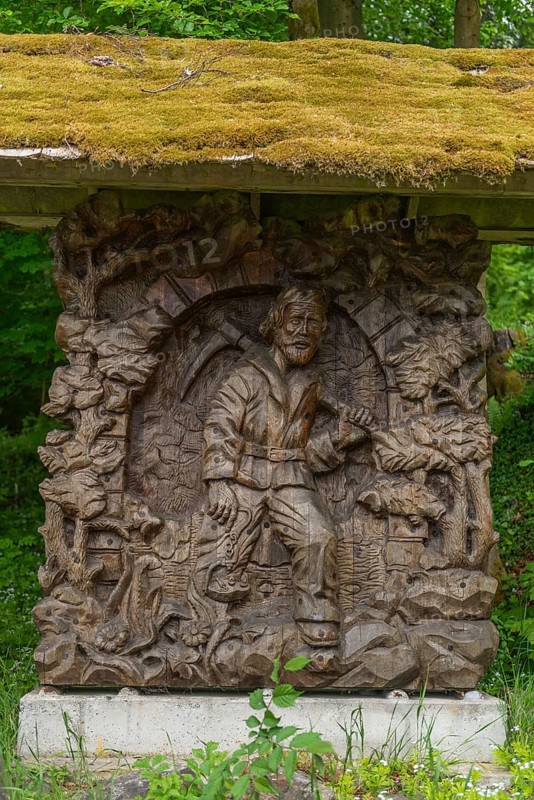 The miner from Meissner leaves the lignite tunnel, mining, GEO nature park Park Frau Holle Land am Meissner, low mountain range, legendary figure, home of the fairy tale, woodwork with ornamentation, wood sculptors Viktor and Ilja Donhauser, district of Kassel, Fulda Werra Bergland, Germany