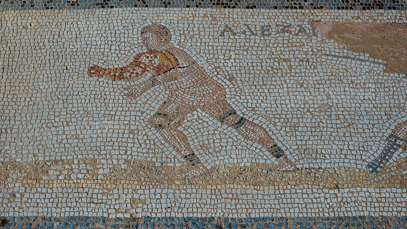Ancient mosaic of a running man in Greek style, Archaeological Site, Western Excavation, Kos Town, Kos, Dodecanese, Greek Islands, Greece