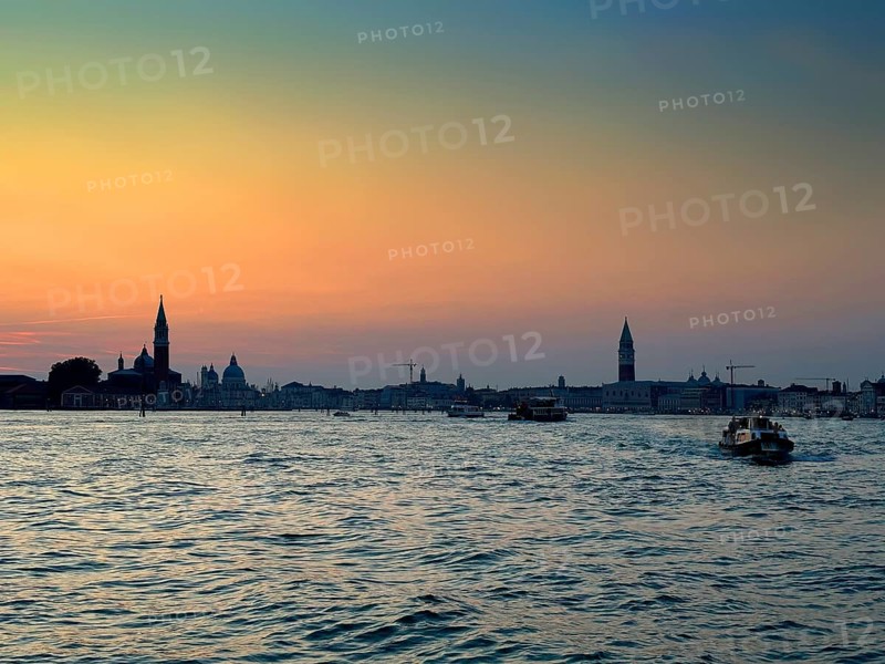 View over the lagoon to Venice at sunset, lagoon city of Venice, Veneto, Italy