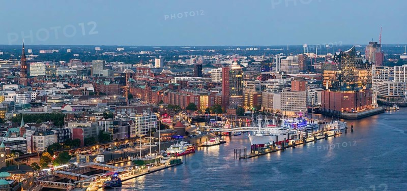 Panoramic aerial view of the Landungsbrücken in the harbour at blue hour with the Elbphilharmonie in the background, Hamburg, Germany