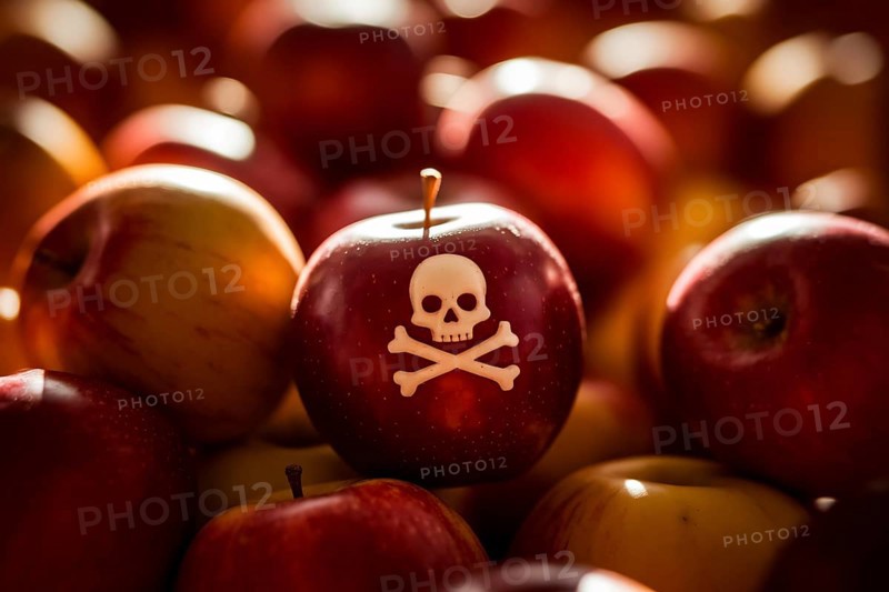 Red apple with carved poison skull among fresh fruit at farmer's market, symbolizing hidden toxins in food. Generative ai, AI generated
