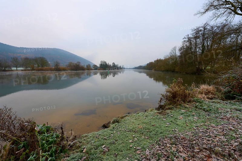 Frosty bank of a quiet river, reflections in the water, wintry landscape, Laudenbach, Main, Spessart, Odenwald, Bavaria Germany