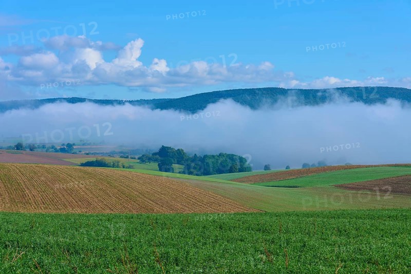 Hilly fields with fog and clear blue sky, Mönchberg, Miltenberg, Spessart, Bavaria, Germany