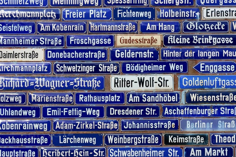 Collection of blue street signs with different street names, Amorbach, Odenwald, Bavaria, Germany