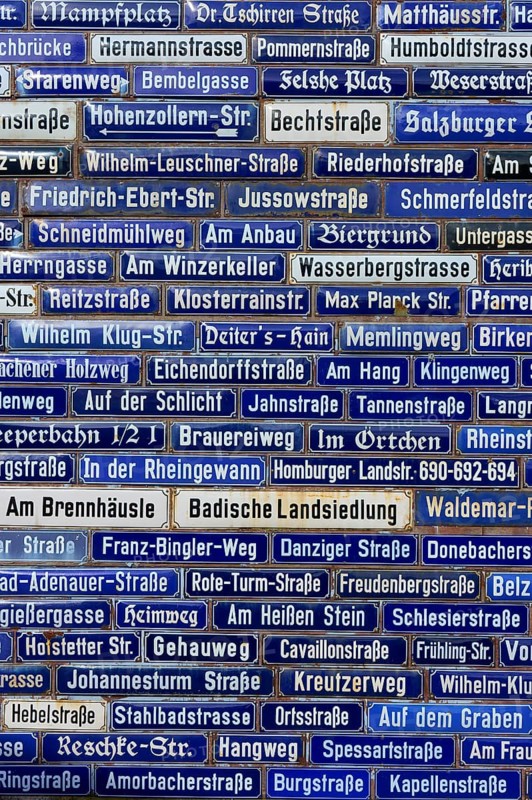 Blue street signs with a variety of names, Amorbach, Odenwald, Bavaria, Germany