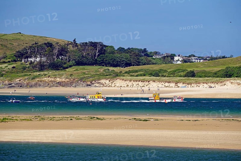 Two boats on the sea with green hills and a clear sky in the background, Padstow, Cornwall, Cornwall, England, United Kingdom