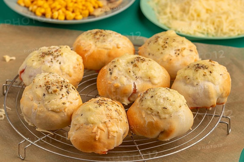 Freshly baked pizza, balls on a grid, ready to cool