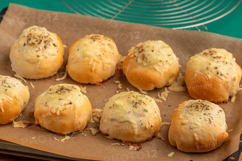 Baked pizza, balls with melted cheese, fresh from the oven