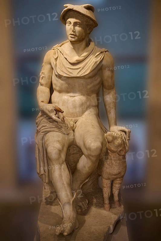 Ancient marble sculpture of a seated man next to a ram, Hermes, seated, on display in the museum, Archaeological Museum, Kos Town, Kos, Dodecanese, Greek Islands, Greece