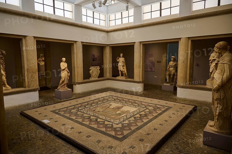 Museum hall with mosaic floor and ancient statues surrounded by columns, Roman House of Asklepios in Serayia, Scene: Asklepios lands on Kos, Archaeological Museum, Kos Town, Kos, Dodecanese, Greek Islands, Greece