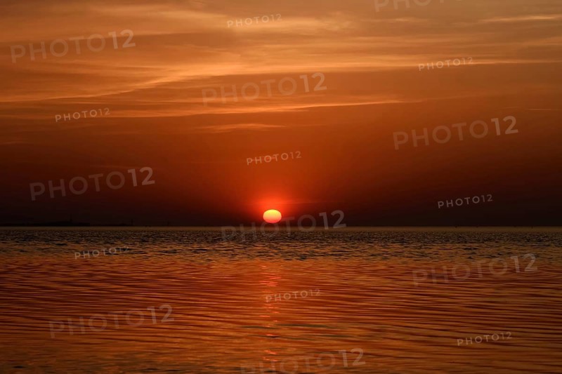 Fireball... Cuxhaven (North Sea), glowing red, setting sun, sunset over the Wadden Sea near Duhnen, sun sinks into the sea, a beautiful day comes to an end, North Sea coast, Germany, Europe, local nature, landscape