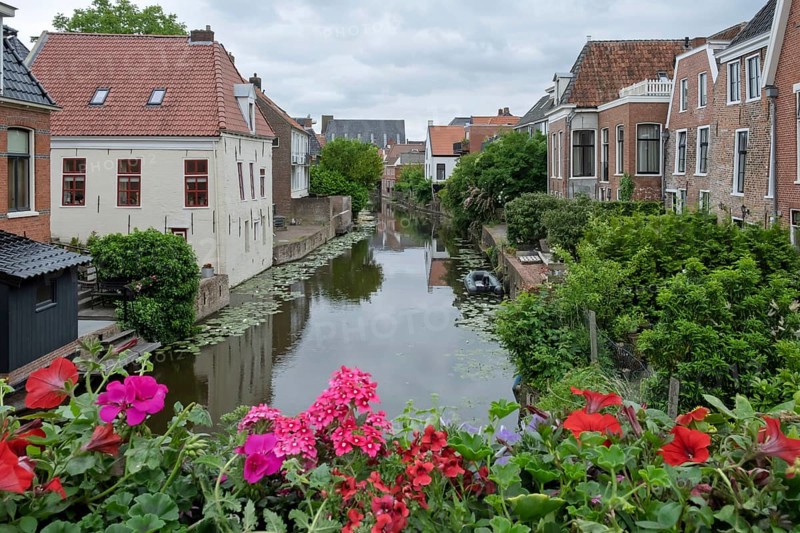 The Damsterdiep canal in the historic town of Appingedam, province of Groningen, Netherlands