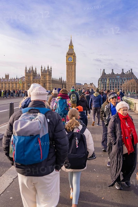 Large group of people on a bridge visiting a famous clock tower, London, United Kingdom, World