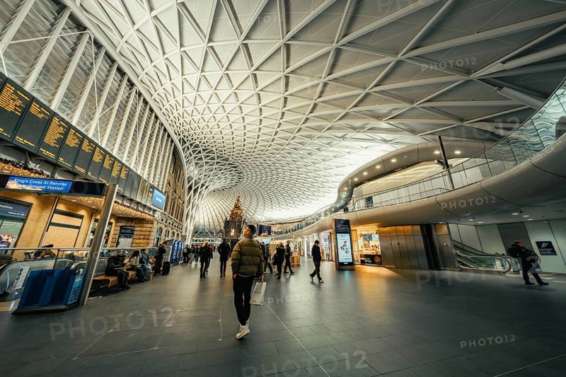 Bright and spacious train station with modern glass architecture and busy travelers, King's Cross Station, London, United Kingdom, World